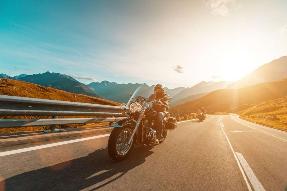 A man is taking a motorcycle road trip.